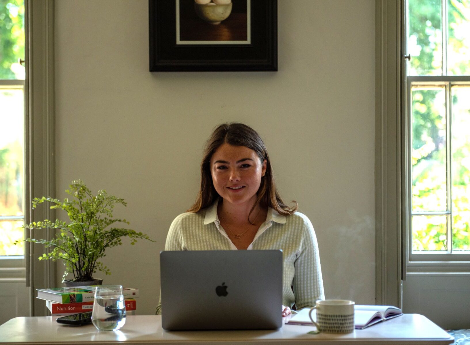 Georgina at desk with a laptop